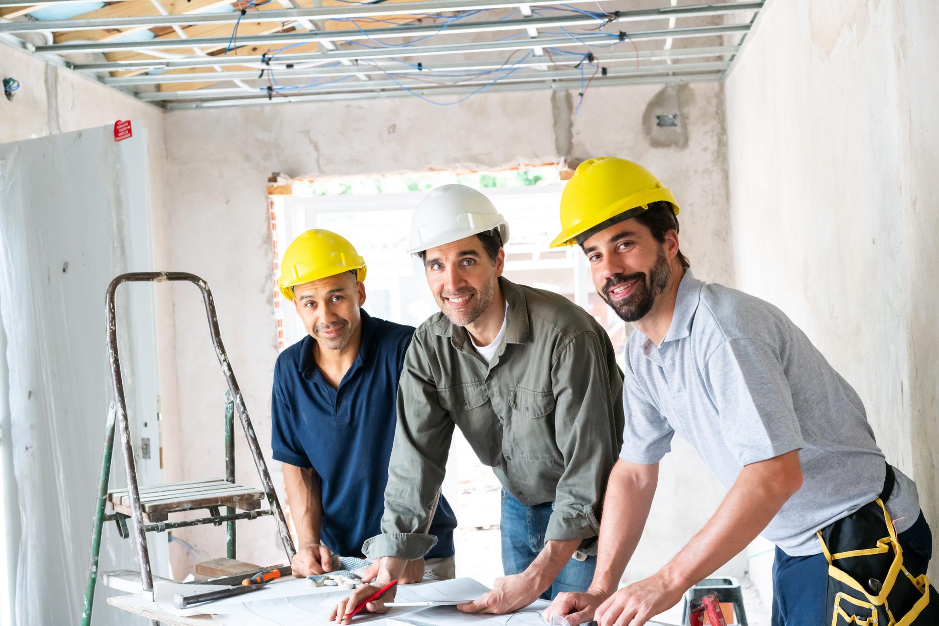 Team of Construction Workers Collaborating on Site