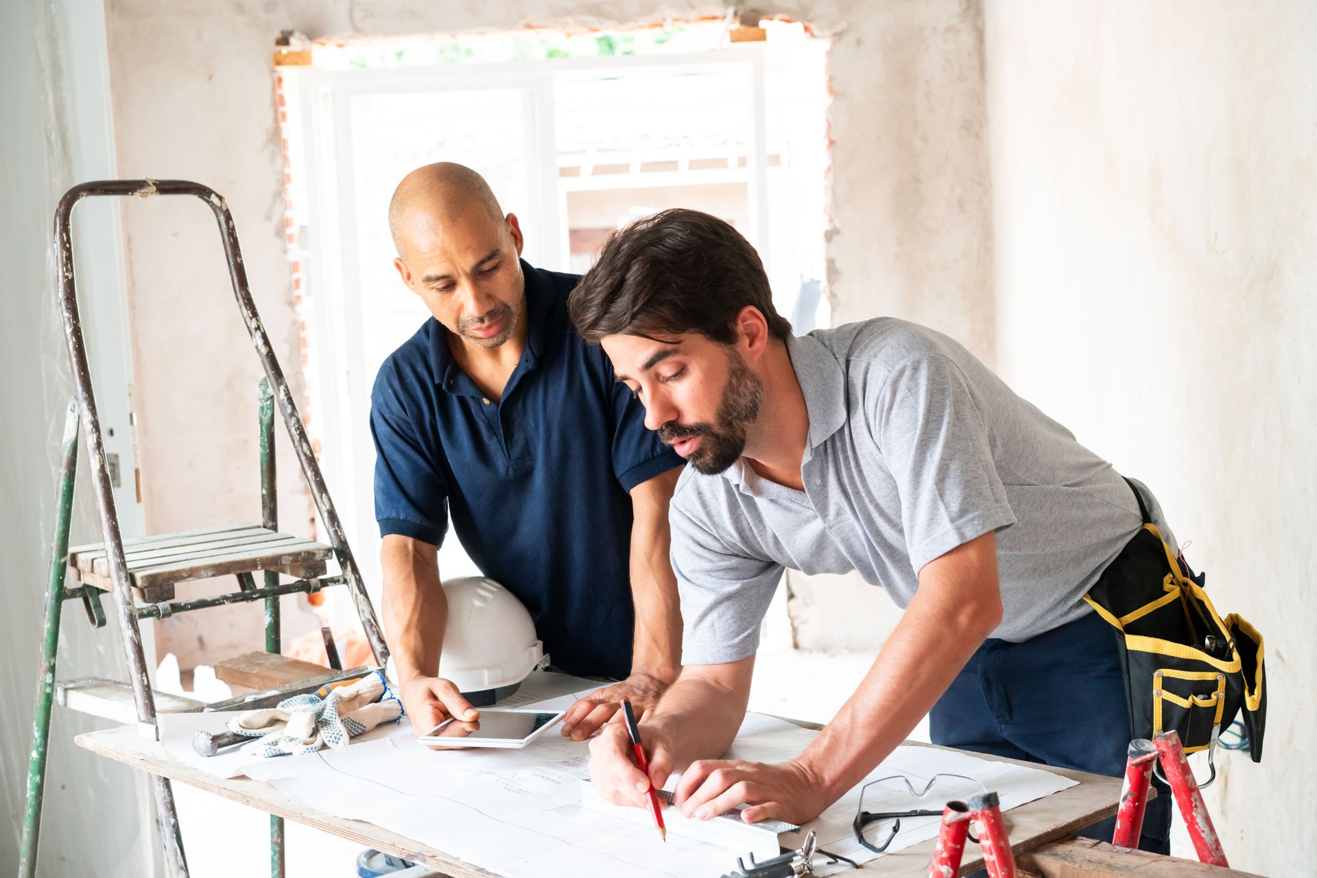 Construction Professionals Discussing Plans at Worksite